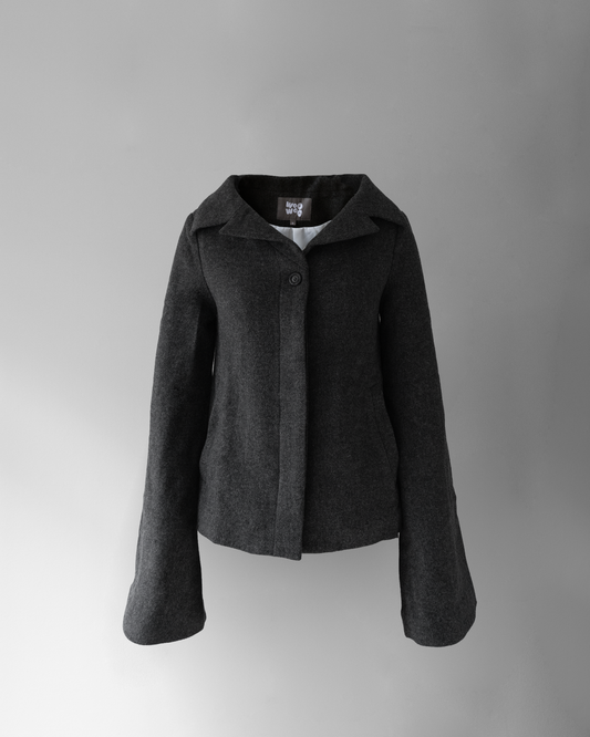 front photo of hello! jacket, a dark grey wool jacket with a wide collar, invisible buttons except for the top button, and long sleeves.
