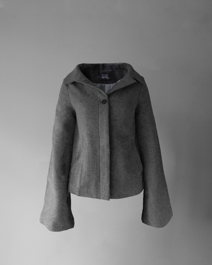 front photo of hello! jacket, a light grey wool jacket with a wide collar, invisible buttons except for the top button, and long sleeves.